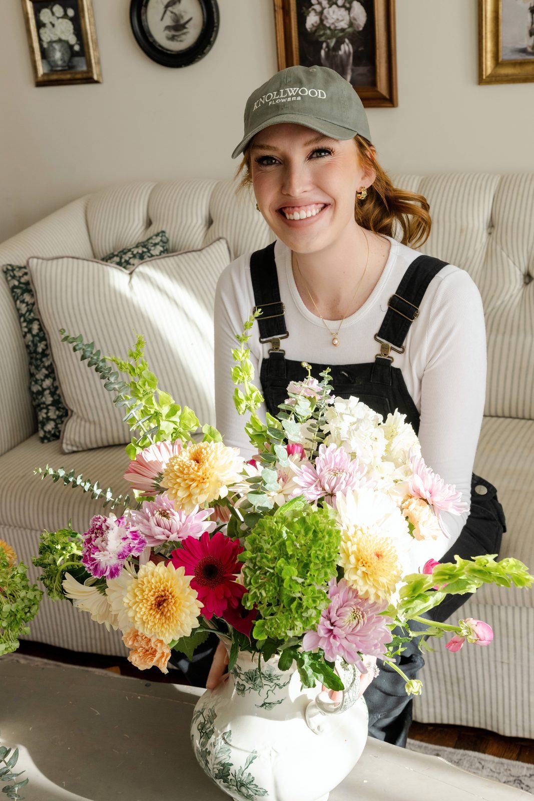 Megan with an armful of fresh-cut dahlias